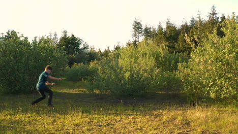 Handsome-15-year-old-teenage-boy-enjoying-his-summer-outdoors-by-doing-flips