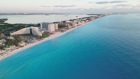 cancun’s beachfront, showcasing resorts along turquoise waters, aerial view, playa delfines