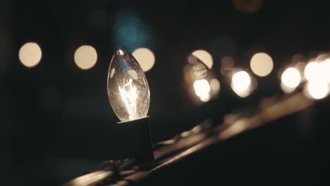 glowing incandescent christmas string lights with blurry background