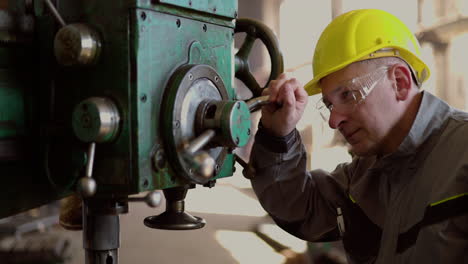 man checking machinery