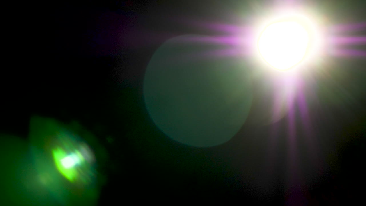 Big abstract lens flare on black background
