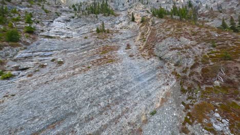 ecological prehistoric limestone layers of etymology reveal rocky mountain peak with 15 out 20 uncommon stones found on cliffs closeup drone flyover 4k 4-4