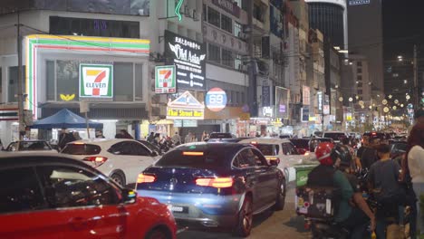 busy night street in kuala lumpur, malaysia