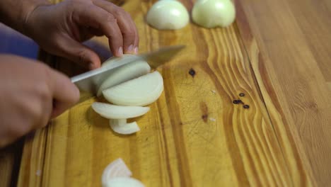 slicing onion chopping into julienne on wooden board kitchen healthy healthy diet