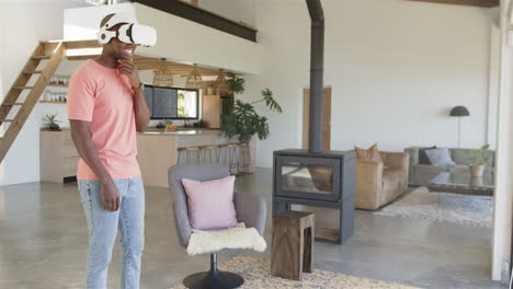 using vr headset, man enjoying virtual reality experience in modern living room, copy space