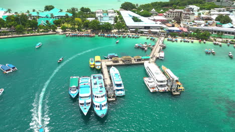 motorboats moored in a beautiful bay and behind buildings
