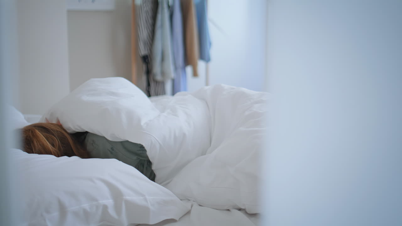 Morning kid sleeping bed closeup. Child girl embracing toy resting at bedroom