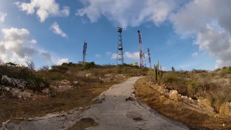 4k-60fps-abstract-wide-angle-fish-eye-shot-of-cellphone-towards-on-top-of-a-hill-in-the-Caribbean