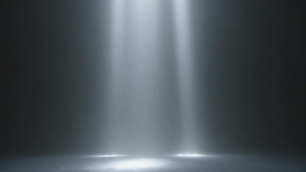 Activating two spotlights casting beams on dark stage to highlight center, revealing haze, dust