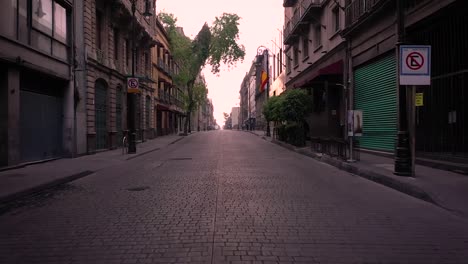 empty street in mexico city during corona quarantine at dusk, dolly in