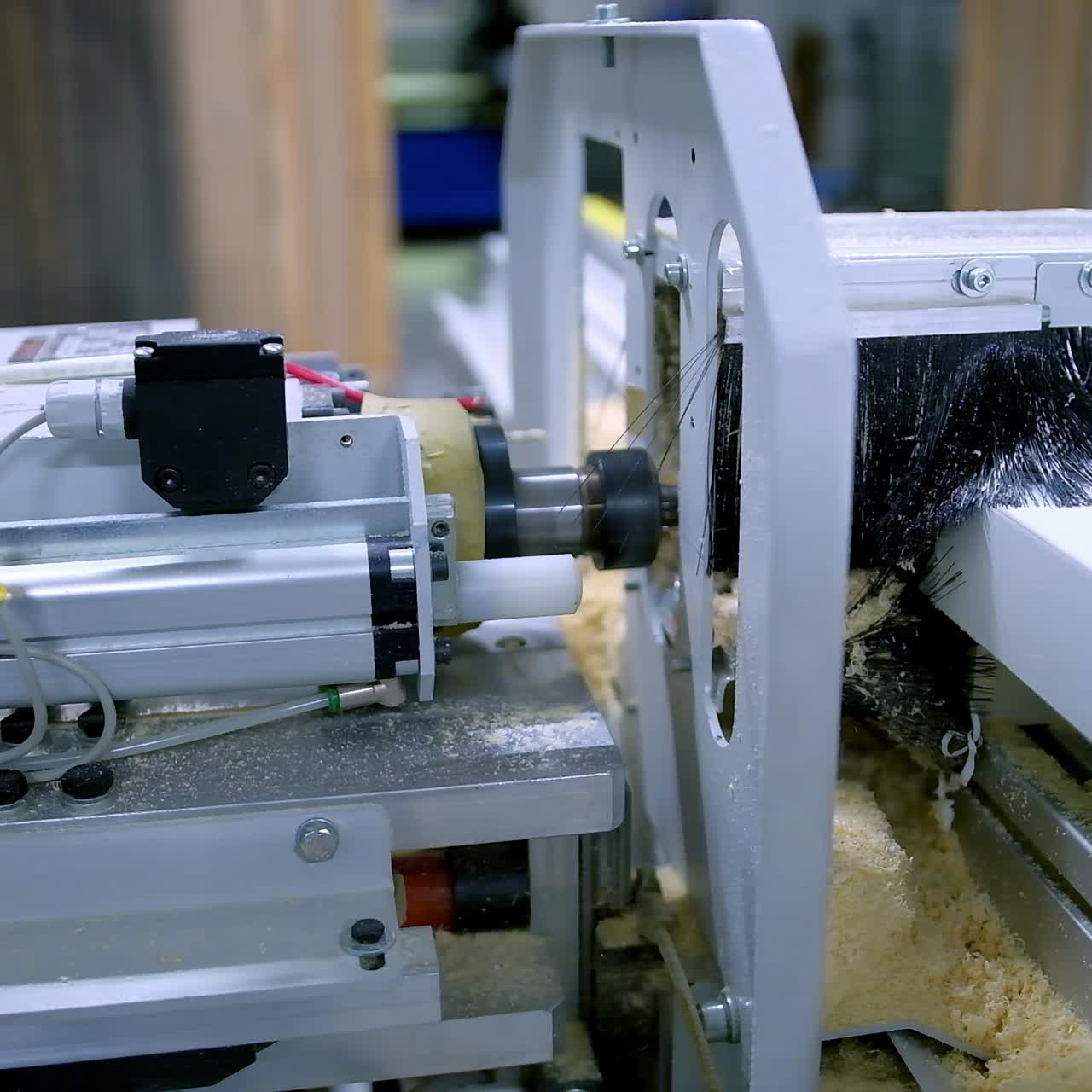 Automated machine in workshop. Manufacturing of doors. Work of modern instrument. Making furniture. Close-up.