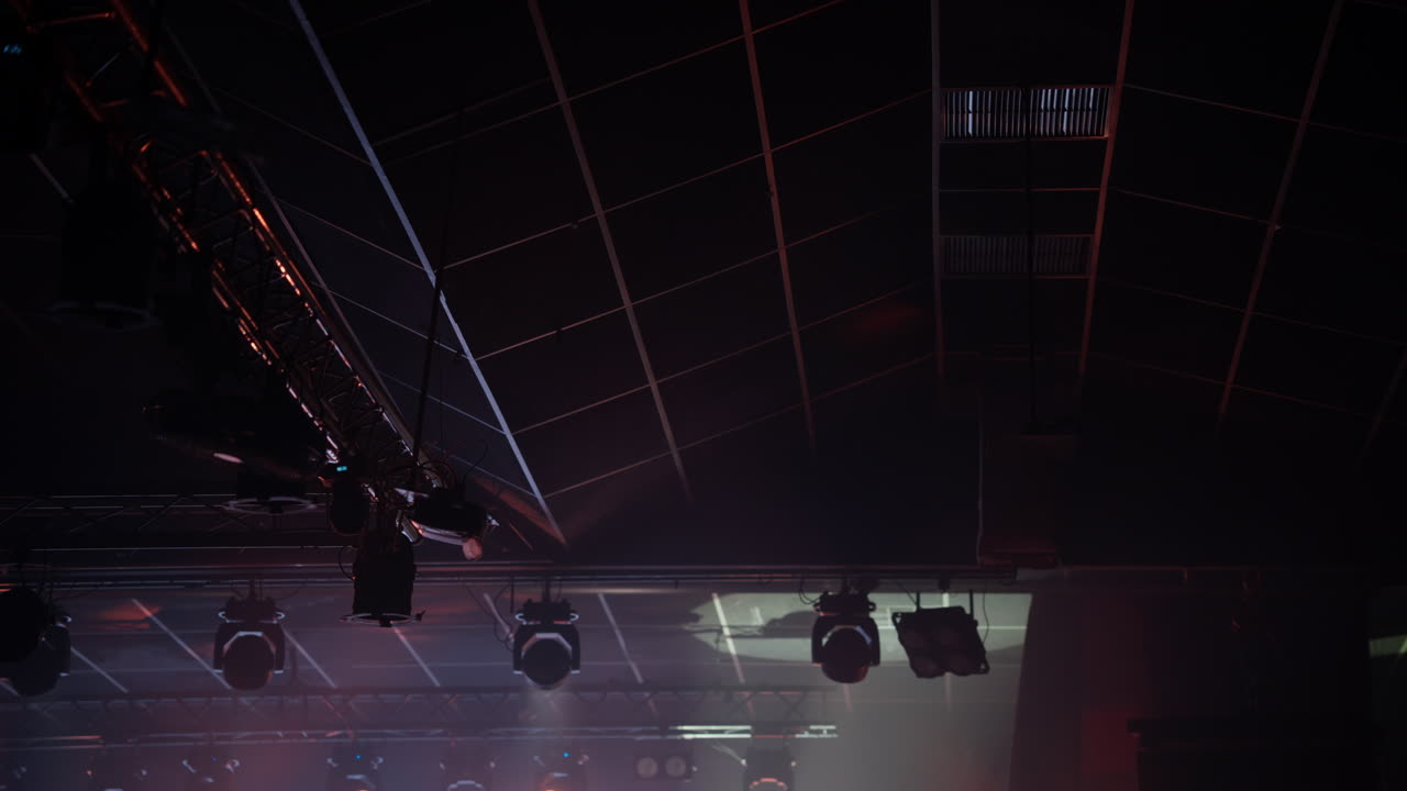 Dynamic Stage Lights Moving and Changing Colors at a Concert