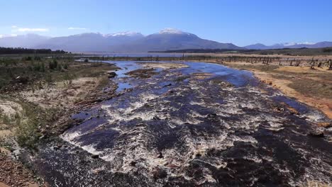 snowmelt flowing into large dam