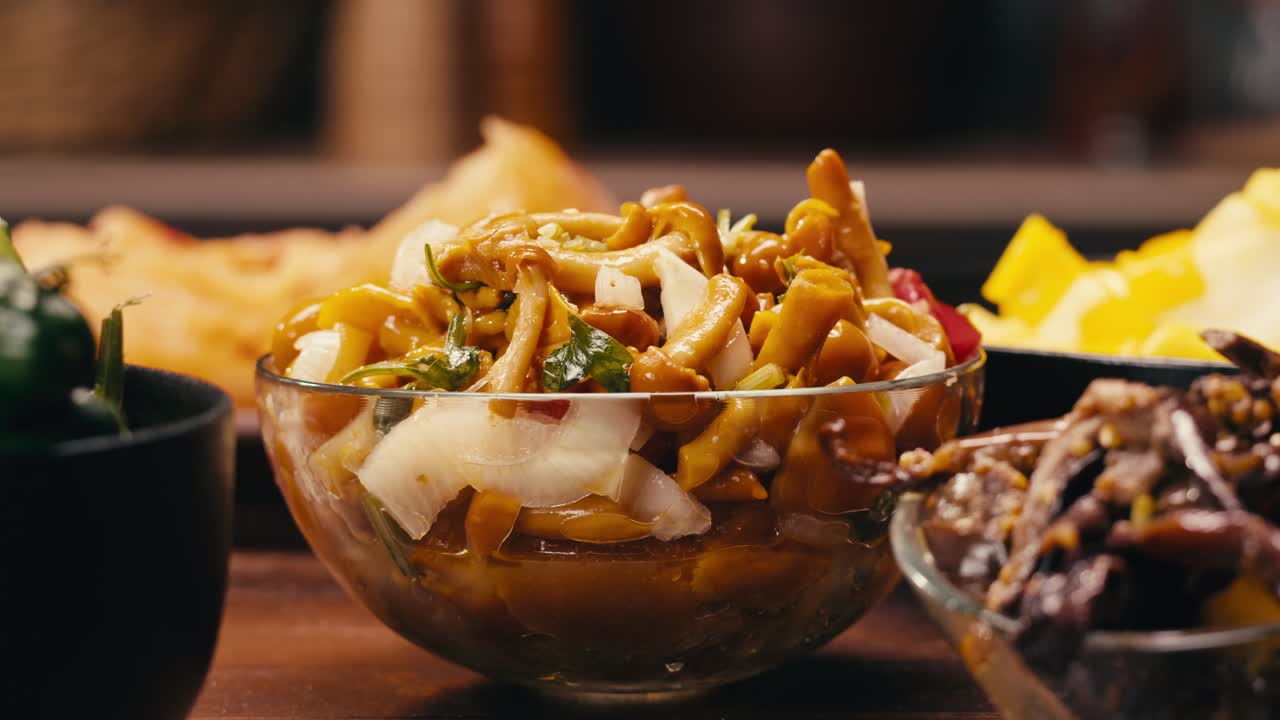 Close-up of fermented yellow honeydew mushrooms with onion in plate. Preservation of vegetables in glass jars. Fermentation preserved mushroom with spices.