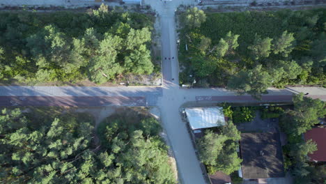 aerial birds eye over walking path crossroad beside promenade at krynica morska