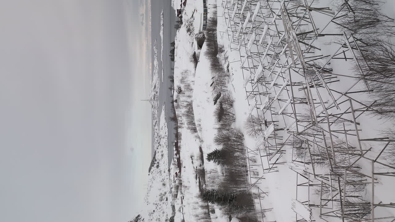 Vertical Shot Of A Winter Snow-Covered Landscape In Lofoten Islands, Northern Norway