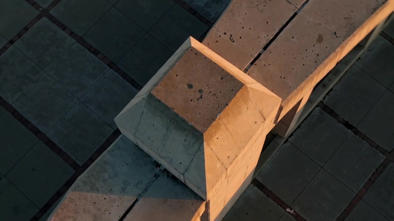 Rotating camera revealing centered concrete cap on beam at plaza, showing joints, pitting, shadows