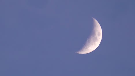 moon as natural earth satellite in waxing crescent phase in evening sky