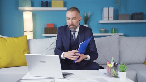 Businessman-in-a-charismatic-suit.-Attends-the-meeting-online-from-home.