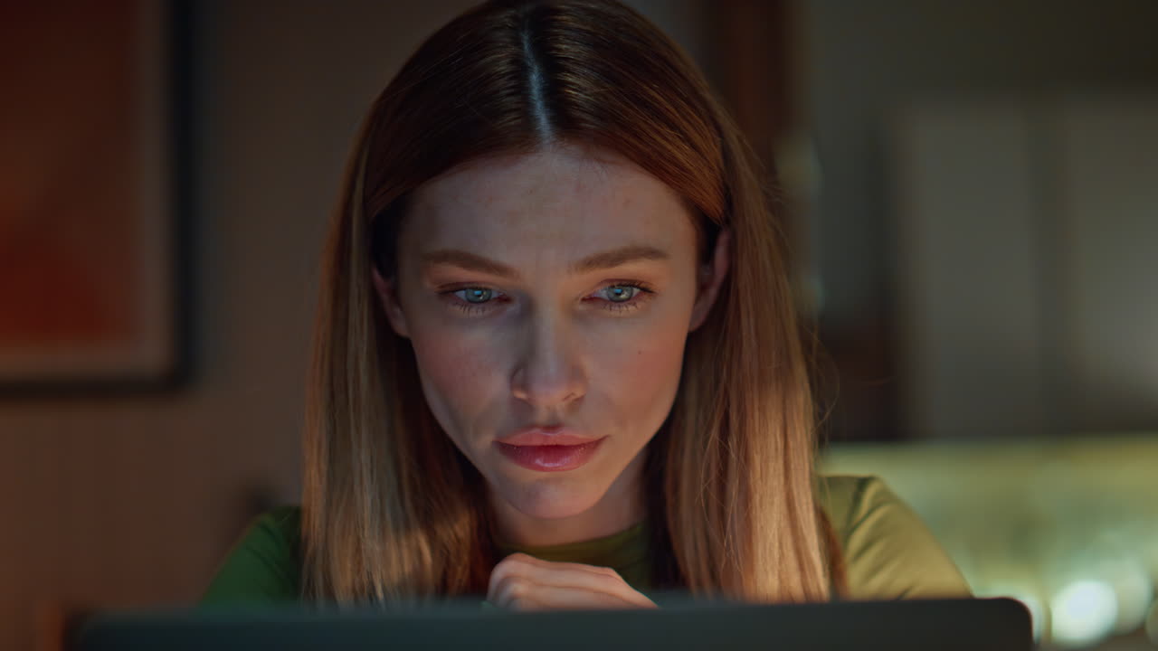 Closeup woman tired late work looking computer. Serious freelancer girl reading