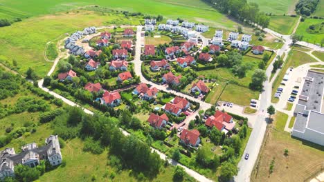 Aerial-view-of-residential-houses-neighborhood-and-apartment-building-complex-at-sunset