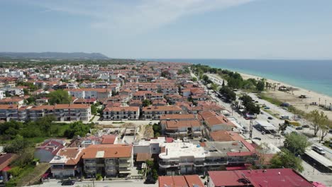 ofrynio beach, tuzla, seaside village in greece, aerial panoramic view of residential buildings developed land