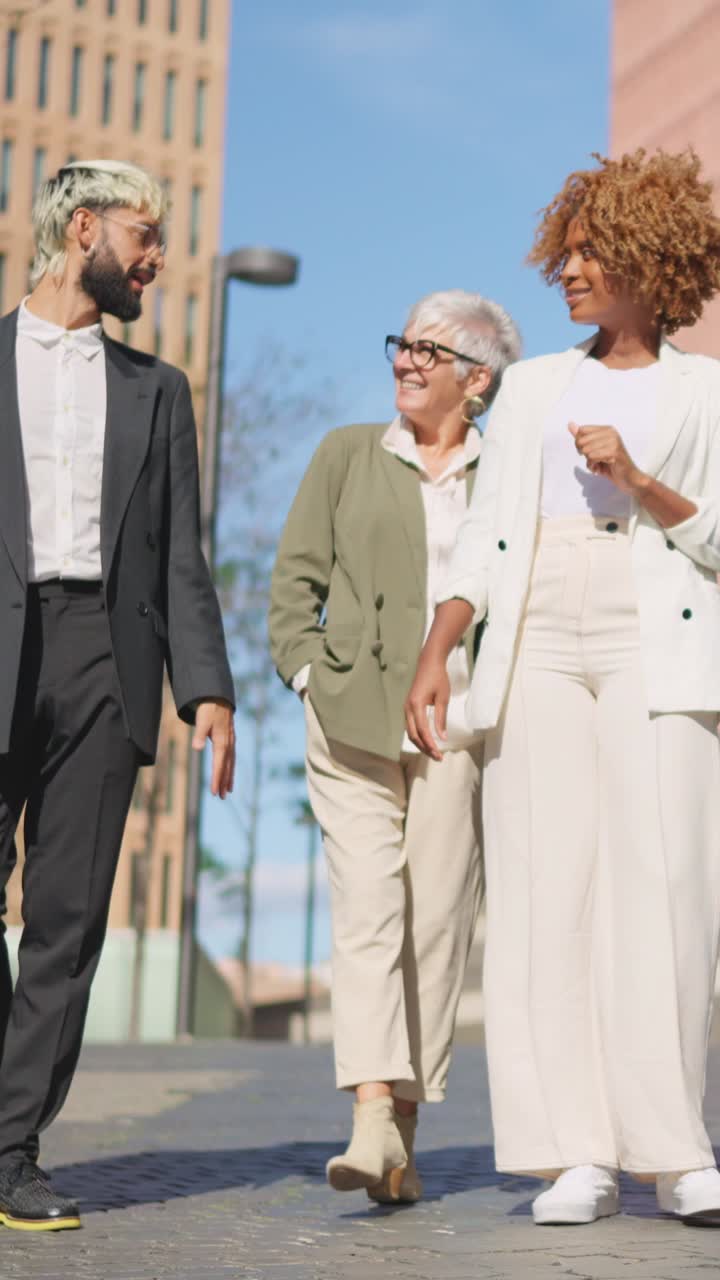 Multicultural global business people walking together along a financial district