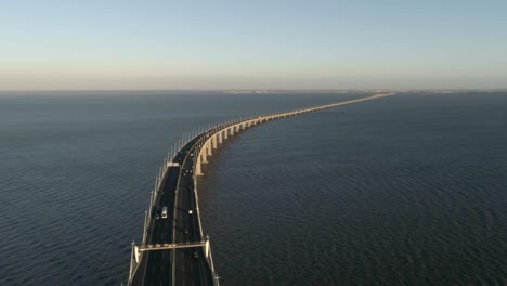 aerial drone video of ponte vasco da gama bridge with cars passing by