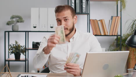 young business man showing money dollar cash gives to you wages salary satisfied with good work