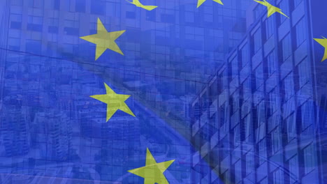 video compuesto de la bandera de la unión europea ondeando contra edificios altos