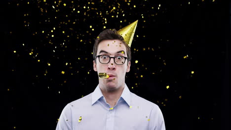 man celebrating with party hat and confetti