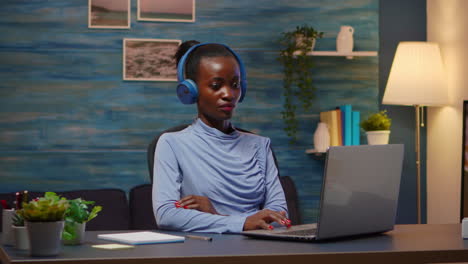 african american with wireless headphones listening online courses