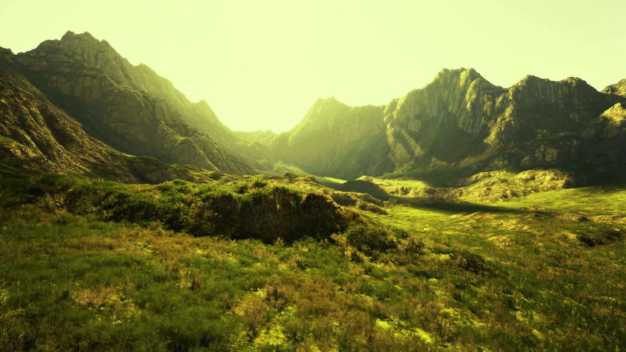 Majestic mountain landscape with sunlight illuminating the valley