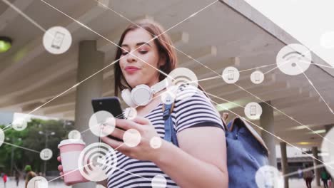 animation of network of connections with icons over caucasian woman with smartphone