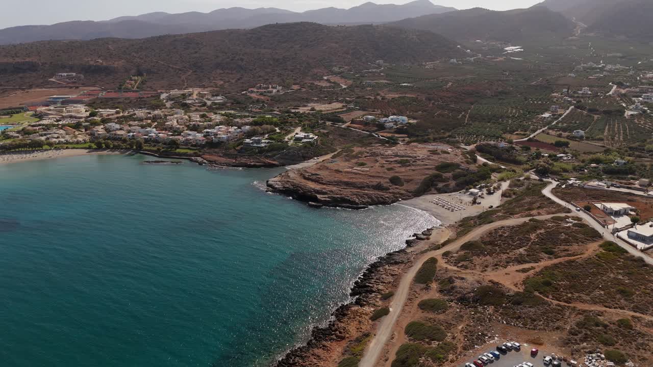 Aerial - small beach with rocky cliffs and scenic surroundings in Crete Greece