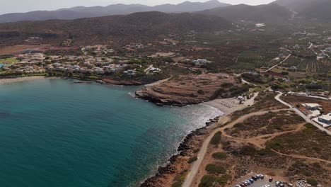 aerial - small beach with rocky cliffs and scenic surroundings in crete greece