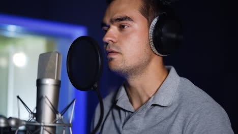singer recording vocals in a studio