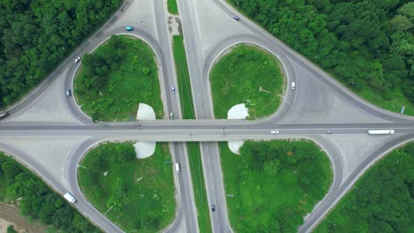 busy urban traffic. aerial top view traffic on circle road in city at day. 4k stock footage.