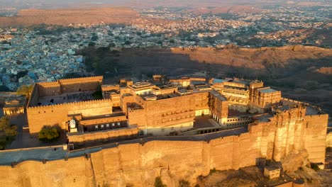 golden hour aerial view of mehrangarh fort at sunrise