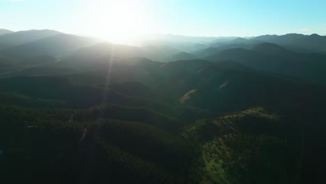 summer sunlight sunset evergreen aerial drone idaho springs golden canyon indian peaks i70 interstate genesse park mountain layers rocky mountains colorado usa tourist commuter drive backwards pan up