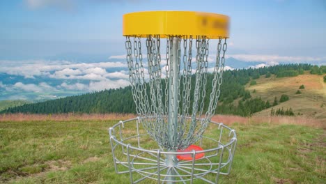 zoom in of frisbee that goes to basket, kope, slovenia