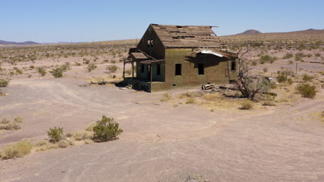 abandoned destroyed old house in western america deserts, approach