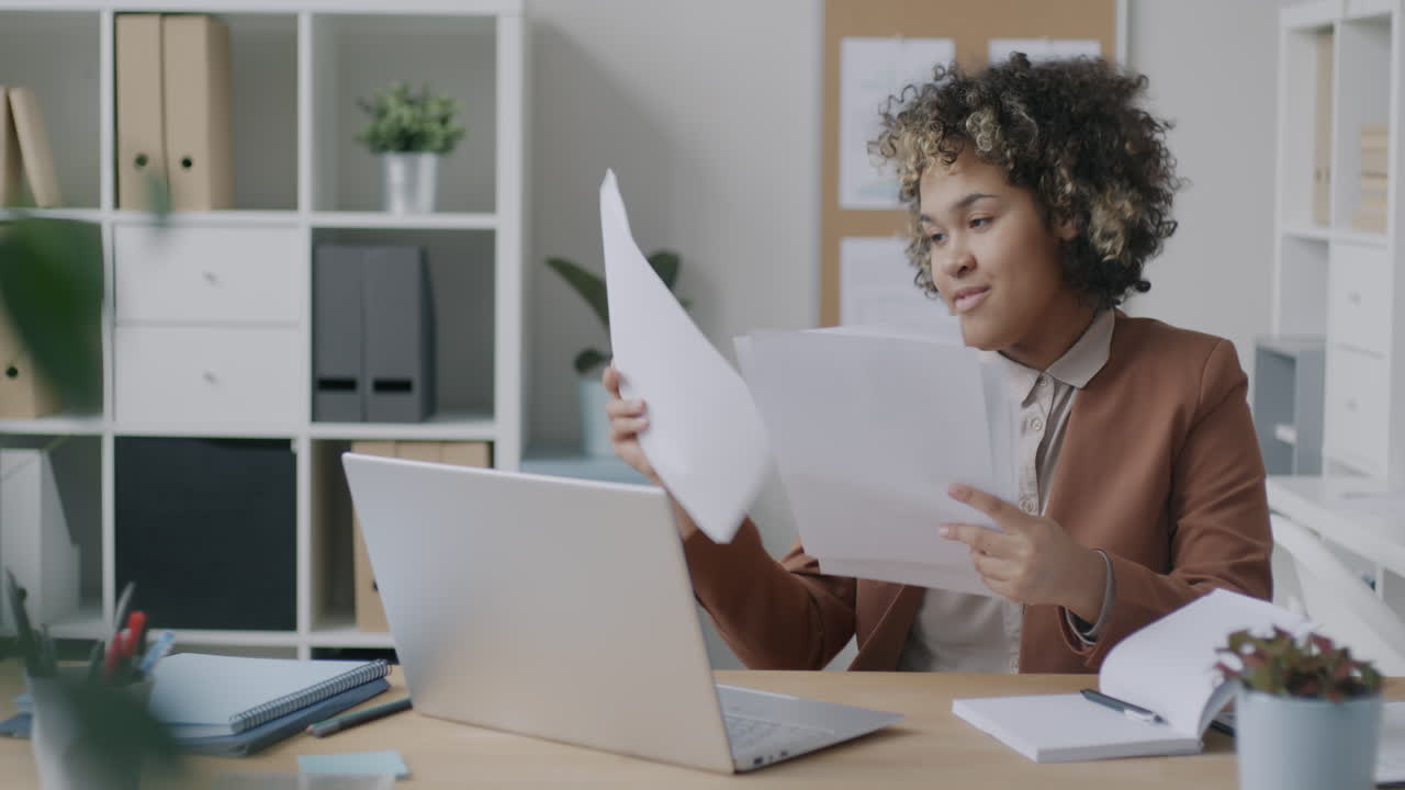 Woman reviewing documents in an office setting