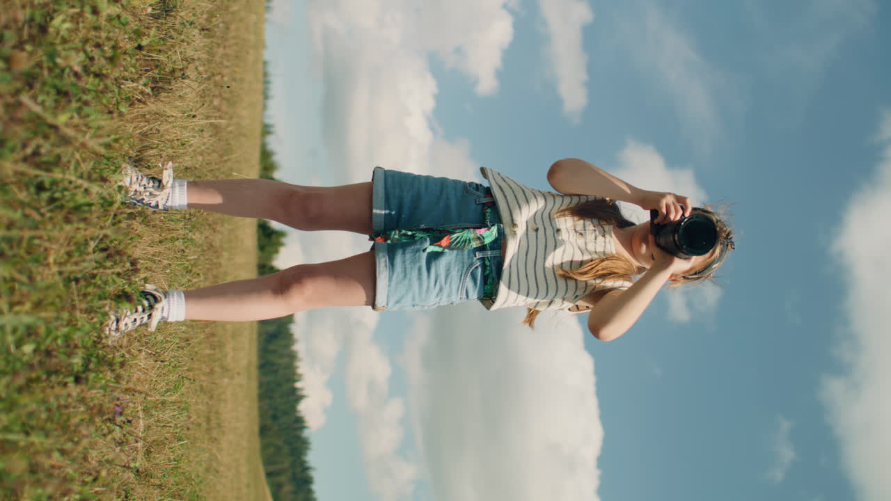 Young Girl Photographer Shooting Landscape Young Photographer Shooting Landscape on Beautifull Green Hillway Taking Pictures of Nature Girl Filling the Portfolio with Amazing Photos Spending Leisure Time Outdoor Slow Motion