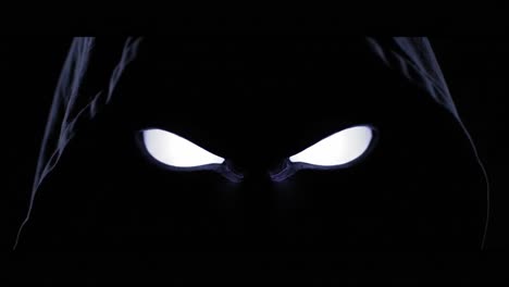 mysterious hooded figure with glowing eyes
