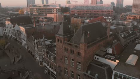 panning up over the rooftops of the historic centre of the city of utrecht in the netherlands with panning down to reveal the canal and wharf street below