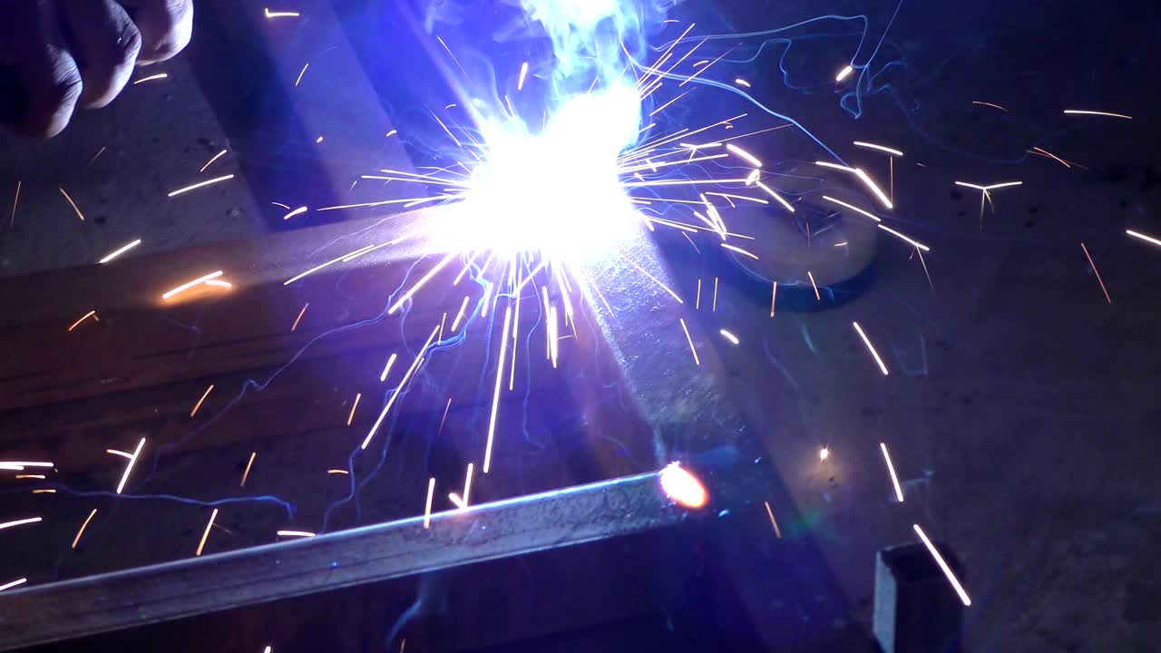 The welding and sparkles flying around with lights