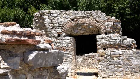 butrint, albania, view of a stone arch and window, elements of the ruins of an ancient building