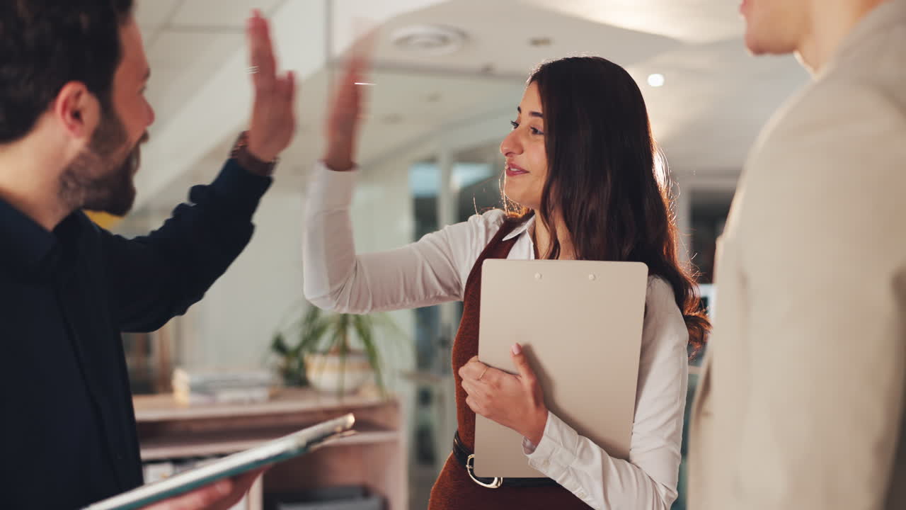 Business team celebrating success with high five