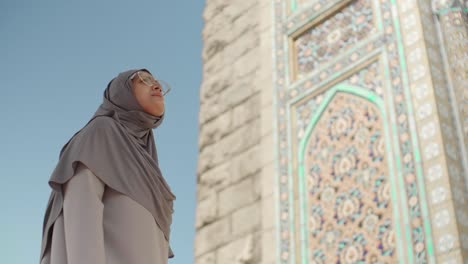 pretty mixed-race woman enjoying the mosque